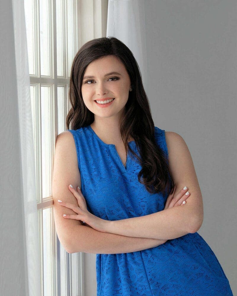 High School Senior Portrait: Gal Leaning Next to Window